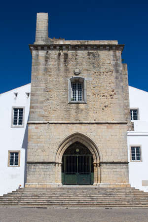 Entrance to Faro Cathedral, Algarve, Portugal, against a blue skyの写真素材