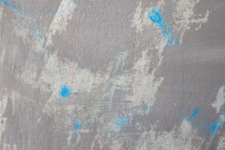 colour and texture of blue paint on a concrete wallの写真素材