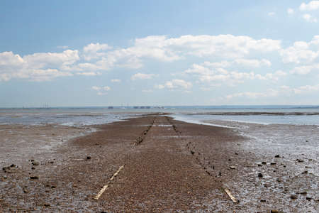 Pathway going out into the sea at Westcliff, Essex, England  on a summer's dayの写真素材