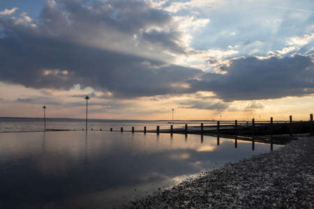 Sunset at Chalkwell beach, near Southend-on-Sea, Essex, England, United Kingdomの写真素材