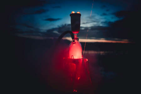 Night hookah on the nature. Near the tent camping on the lake.のeditorial素材