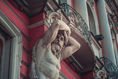 An old stucco face of a man with a beard on the building in Saint-Petersburg, Russiaのeditorial素材