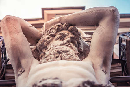 An old stucco face of a man with a beard on the building in Saint-Petersburg, Russiaのeditorial素材