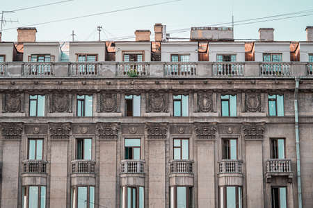 Beautiful Old Mansion With Stucco Molding Balcony in Saint-Petersburg, Russia. Stucco molding on the top part of a facade.のeditorial素材