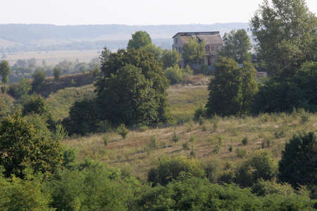 The house on the mountain is a beautiful summer landscape.の写真素材