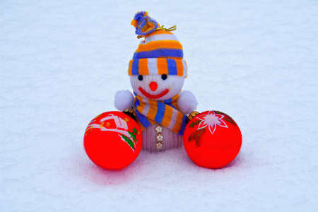 New Year's snowman with toys in the snow.の写真素材