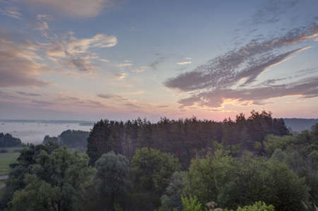 Morning mist and sunrise.の写真素材