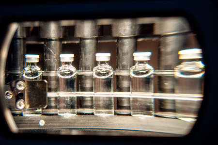 Vials with drugs or vaccine during productionの写真素材