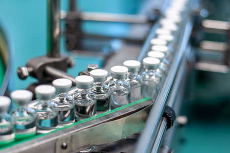 Vials with drugs or vaccine during productionの写真素材