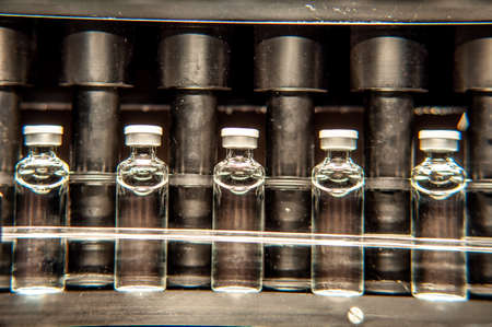 Vials with drugs or vaccine during productionの写真素材