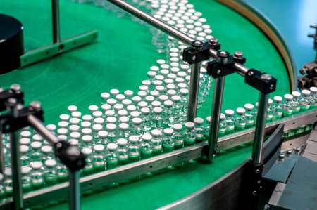 Vials with drugs or vaccine during productionの写真素材