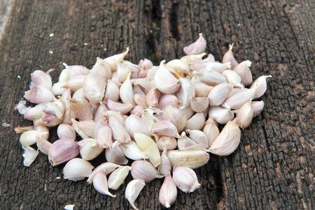 garlic on wood backgroundの写真素材