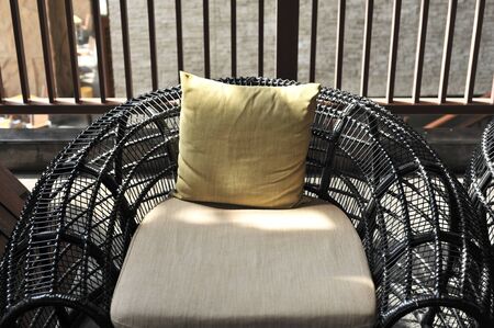 outdoor furniture rattan chairs with pillow on terraceの写真素材