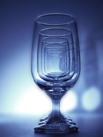 Repetitive pattern of six glasses in a line.