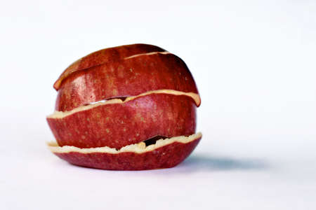 Peeled apple skin holding form.の写真素材