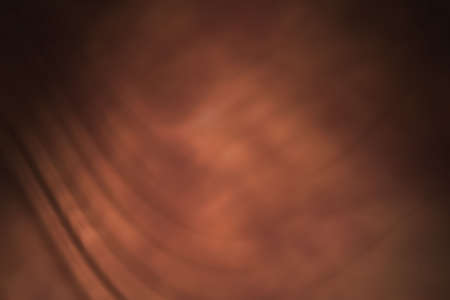 Tan studio backdrop with folds.の写真素材