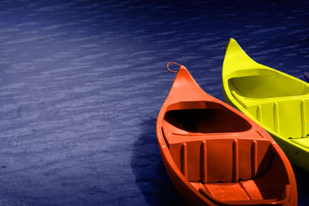 Two hire boats on calm water.の写真素材