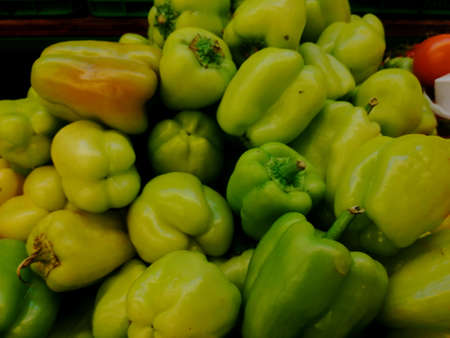 Raw Sweet Peppers are ready for cooking. Green backgroundの写真素材