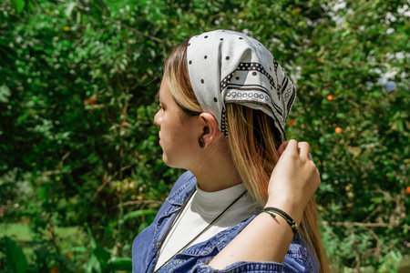 Latin woman planting in the garden in springの写真素材