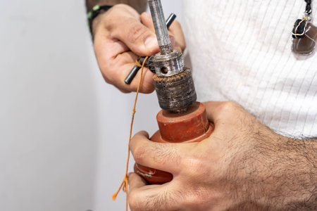 man working with a drill at homeの写真素材