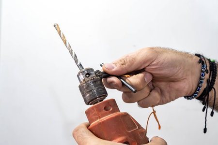 man working with a drill at homeの写真素材