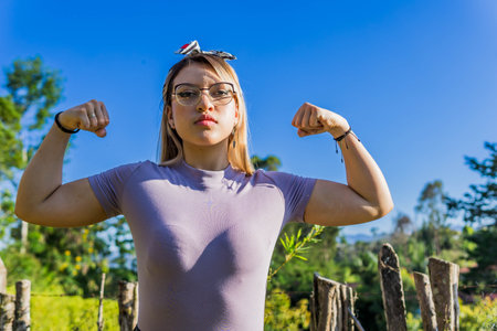 Women Day, March 8, empowered and self-confident woman. Woman expressing leadership and character. Woman happy in nature. Girl with glasses.の写真素材