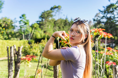 Women Day, March 8, empowered and self-confident woman. Woman expressing leadership and character. Woman happy in nature. Girl with glasses.の写真素材