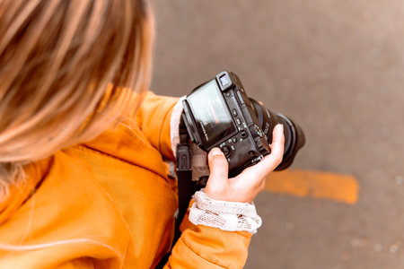 Latina woman photographer on a hot day taking pictures on vacation. Nature and sunlight. World...