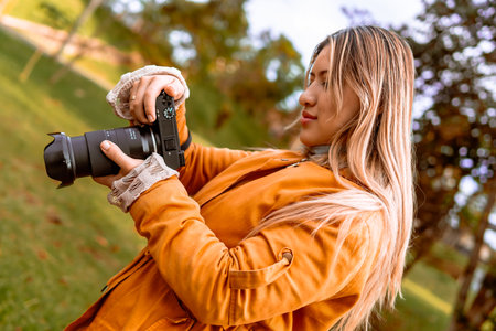 Latina woman photographer on a hot day taking pictures on vacation. Nature and sunlight. World...