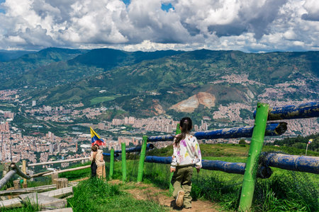 Colombian family enjoying scenic mountain view with city in the backgroundの写真素材