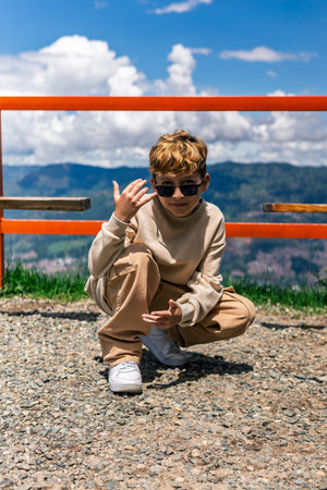 Smiling Colombian boy in a natural setting, concept of childhood, diversity and emotional connectionの写真素材