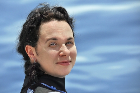 Portrait of the girl against the seaの写真素材