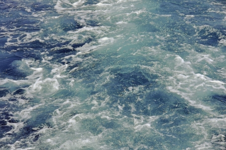Sea water in the wake of the ship foaming formation and ragesの写真素材