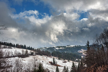 Winter Carpathians, snow-capped mountains and forestの写真素材