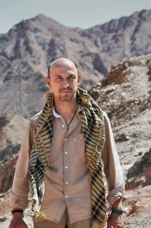 Portrait of a man in the Arab scarf