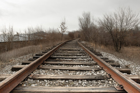 Railway tracks leading to the horizon in the countryside. The concept of travel and transportation.の写真素材