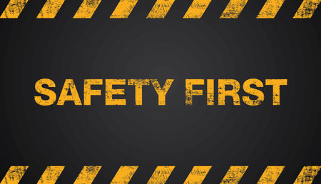 Safety First,  grunge yellow and black diagonal stripes on background, Vector illustration.のイラスト素材