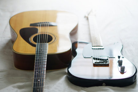Electric guitar and acoustic guitar, Used to play music and notes.