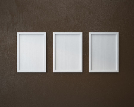 3 Blank frame on  brown wall.の写真素材