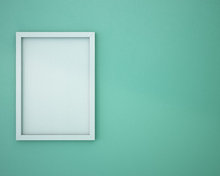 Blank frame on green wall.の写真素材