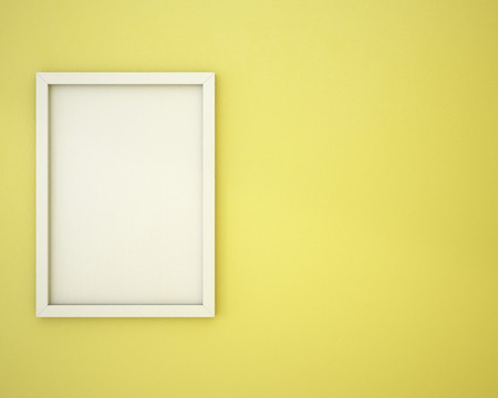 Blank frame on custard yellow  wallの写真素材