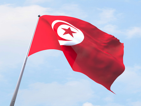 Tunisia flag flying on clear sky.の写真素材