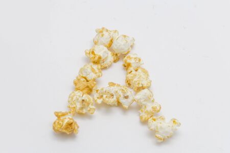 pop corn forming letter A isolated on white backgroundの写真素材