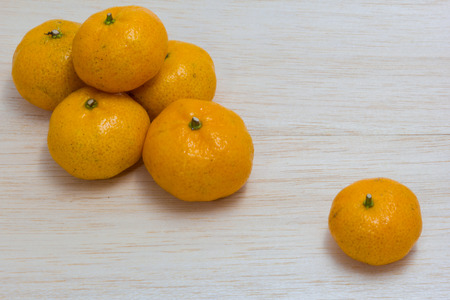 orange on wood backgroundの写真素材