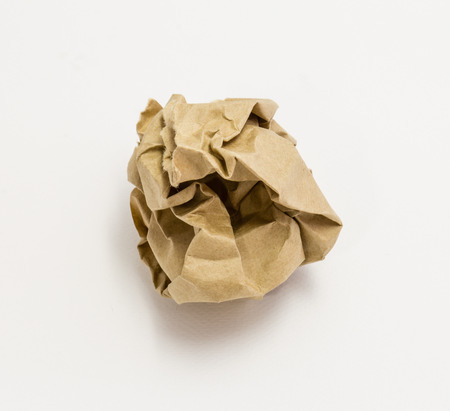 brown paper ball isolated on white backgroundの写真素材