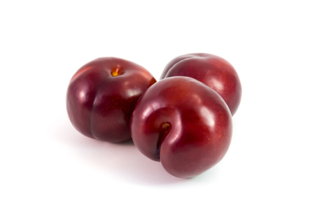 Prunes Plum fruit isolated on whiteの写真素材