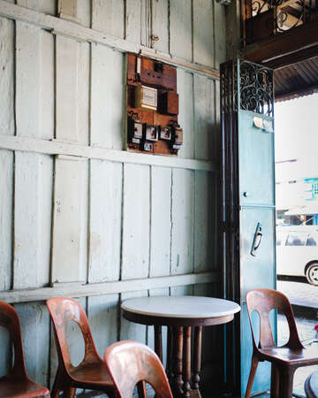 A "kopitiam" (coffee shop) opens its doors along the wooden shophouses in Semerah, a transit town between Muar and Batu Pahat in the state of Johor, Malaysia.のeditorial素材