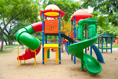 Plastic slide for small children and Bright colorful playground at a park