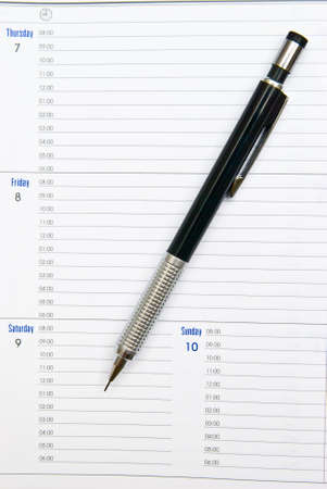 Writing Pencil on the Notebookの写真素材