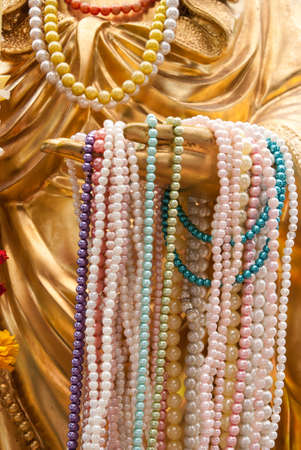 Hand of Guan-yin statue in thai templeの写真素材